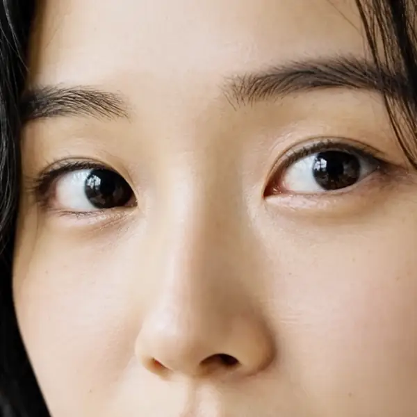 Close-up of a woman's eyes before enhancement