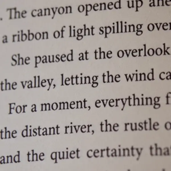 Close-up of softly focused text on a book page before enhancement